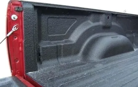 Spray-on bedliner applied to a pickup truck's cargo area.