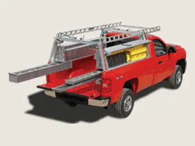 Red utility truck equipped with ladder racks and open storage compartment.