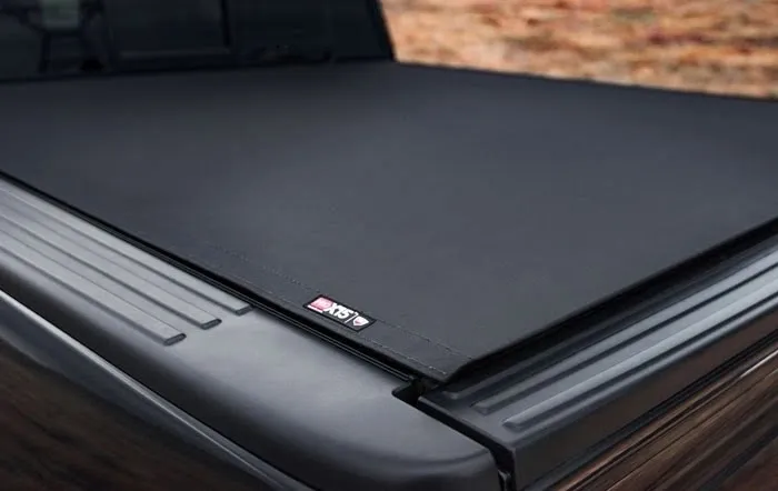 Black tonneau cover on a pickup truck bed.